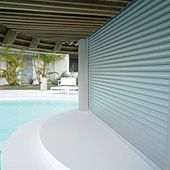 roller shutters on entrance to large swimming pool